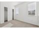 Bedroom featuring closet, multiple windows with blinds, and neutral carpet at 458 Millwall Cir, Castle Pines, CO 80108