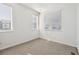 Bedroom featuring multiple windows with blinds and neutral carpet at 458 Millwall Cir, Castle Pines, CO 80108