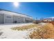Spacious backyard with a deck and a glimpse of the surrounding landscape at 51 W 6Th Pl, Byers, CO 80103