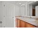 Bright bathroom featuring a double sink vanity and large mirrors at 51 W 6Th Pl, Byers, CO 80103