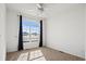 Bedroom with a large arched window providing plenty of natural light at 51 W 6Th Pl, Byers, CO 80103