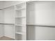 Organized walk-in closet with shelving and hanging rods at 51 W 6Th Pl, Byers, CO 80103