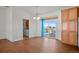Bright dining area with wood floors, sliding glass door to deck, and chandelier at 51 W 6Th Pl, Byers, CO 80103