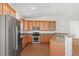 Well-appointed kitchen with stainless steel appliances, wooden cabinets and granite countertops at 51 W 6Th Pl, Byers, CO 80103
