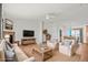 Inviting living room with comfortable seating, fireplace, and entertainment center at 51 W 6Th Pl, Byers, CO 80103