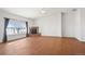 Large living room with fireplace and large picture window at 51 W 6Th Pl, Byers, CO 80103