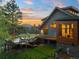 Stunning home featuring an expansive deck with seating and beautiful views at 34089 Woodland Dr, Evergreen, CO 80439
