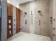 A luxurious shower space with tile surround, dual shower heads, built-in shelving, and modern fixtures at 34089 Woodland Dr, Evergreen, CO 80439