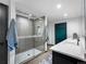 Modern bathroom features a luxurious glass shower, double sink vanity, and sleek fixtures at 34089 Woodland Dr, Evergreen, CO 80439