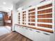Custom closet with built-in shelves, stylish cabinetry, wood accents, and ample storage space at 34089 Woodland Dr, Evergreen, CO 80439