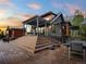Beautiful multi-tiered deck with an outdoor kitchen and dining area, perfect for entertaining at 34089 Woodland Dr, Evergreen, CO 80439
