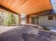 Home exterior displaying covered parking with stylish wood accents and architectural details at 34089 Woodland Dr, Evergreen, CO 80439