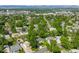 Panoramic aerial view of a neighborhood with mature trees, well-maintained homes, and mountain views at 5167 S Pearl St, Littleton, CO 80121