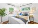 Cozy bedroom with natural light, complemented by comfortable decor and stylish furnishings at 5167 S Pearl St, Littleton, CO 80121