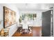 Bright dining area with modern decor, white table, and stainless-steel appliances at 5167 S Pearl St, Littleton, CO 80121