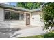 Close-up of home's entrance with a tidy porch, and a charming front door at 5167 S Pearl St, Littleton, CO 80121