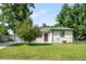 Charming single-story home featuring a well-maintained lawn and mature trees at 5167 S Pearl St, Littleton, CO 80121