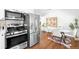 Kitchen with stainless steel appliances, flowing into dining room at 5167 S Pearl St, Littleton, CO 80121