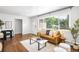 Cozy living room featuring a large window, stylish decor, and modern furnishings at 5167 S Pearl St, Littleton, CO 80121