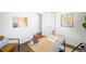 Another view of a bright home office with a spacious desk and comfortable seating at 5167 S Pearl St, Littleton, CO 80121