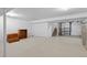 Spacious basement with white walls and concrete flooring at 14300 Waterside Ln # E3, Broomfield, CO 80023