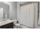 Bathroom features a tub/shower combination with a shower curtain at 14300 Waterside Ln # E3, Broomfield, CO 80023