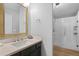 Bathroom with a vanity and updated tiled shower at 14300 Waterside Ln # E3, Broomfield, CO 80023