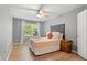 Cozy bedroom featuring natural light and a ceiling fan at 14300 Waterside Ln # E3, Broomfield, CO 80023