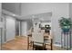 Bright dining area with wood floors connecting to a kitchen and living area; modern and open design at 14300 Waterside Ln # E3, Broomfield, CO 80023