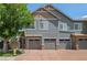 Townhomes with stone accents and two car garages at 14300 Waterside Ln # E3, Broomfield, CO 80023