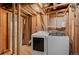 Washer and dryer in unfinished basement at 14300 Waterside Ln # E3, Broomfield, CO 80023