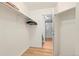 Walk-in closet with hanging rods and shelving, providing ample storage space at 14300 Waterside Ln # E3, Broomfield, CO 80023