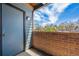 Private patio with a brick wall, offering a serene outdoor space and natural light at 12037 E Harvard Ave # 104, Aurora, CO 80014