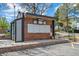 Outdoor community mailboxes in a brick structure with a covered area at 12037 E Harvard Ave # 104, Aurora, CO 80014