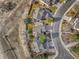 Birds eye view of homes with gray roofs and long driveways alongside curved cul-de-sac street at 10941 Parker Vista Rd, Parker, CO 80138