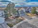 Aerial view of the home with a well-maintained lawn, showcasing the home's location in the neighborhood at 10941 Parker Vista Rd, Parker, CO 80138