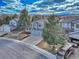 Aerial view of the home and neighborhood with lush landscaping and ample parking at 10941 Parker Vista Rd, Parker, CO 80138