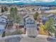 Aerial view of the home with lush landscaping and neighborhood surroundings at 10941 Parker Vista Rd, Parker, CO 80138