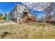 Exterior view of the home showing a deck with access to the backyard at 10941 Parker Vista Rd, Parker, CO 80138