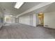 Spacious basement with ample natural light, neutral carpet, and convenient access to the exterior at 10941 Parker Vista Rd, Parker, CO 80138