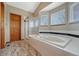 Bathroom featuring a large soaking tub and a glass-enclosed shower at 10941 Parker Vista Rd, Parker, CO 80138