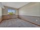 Bedroom featuring neutral-colored walls and plush gray carpeting with a window at 10941 Parker Vista Rd, Parker, CO 80138