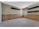 Cozy bedroom with carpet, natural light, and decorative floating shelves at 10941 Parker Vista Rd, Parker, CO 80138