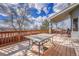 Outdoor deck with a table and chairs, perfect for enjoying the fresh air and scenic views at 10941 Parker Vista Rd, Parker, CO 80138