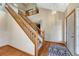 Elegant entryway featuring a staircase, hardwood floors, and modern lighting at 10941 Parker Vista Rd, Parker, CO 80138