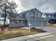 Charming two-story home with well-maintained lawn and two-car garage at 10941 Parker Vista Rd, Parker, CO 80138