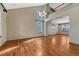 Spacious living room with hardwood floors and large windows offering abundant natural light at 10941 Parker Vista Rd, Parker, CO 80138