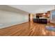 Open-concept living room with hardwood floors seamlessly connected to a modern kitchen at 10941 Parker Vista Rd, Parker, CO 80138