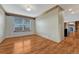 Cozy room with hardwood floors, light gray walls, and a large window providing natural light at 10941 Parker Vista Rd, Parker, CO 80138