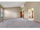 Spacious primary bedroom with vaulted ceilings and a private bathroom at 10941 Parker Vista Rd, Parker, CO 80138